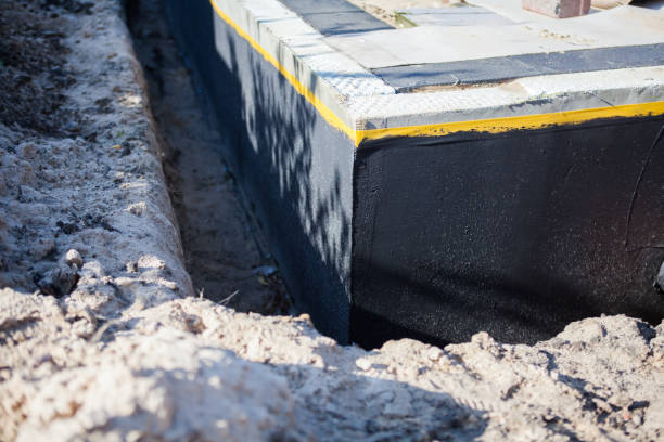Professional Waterproofing technician working in Spring Arbor, MI